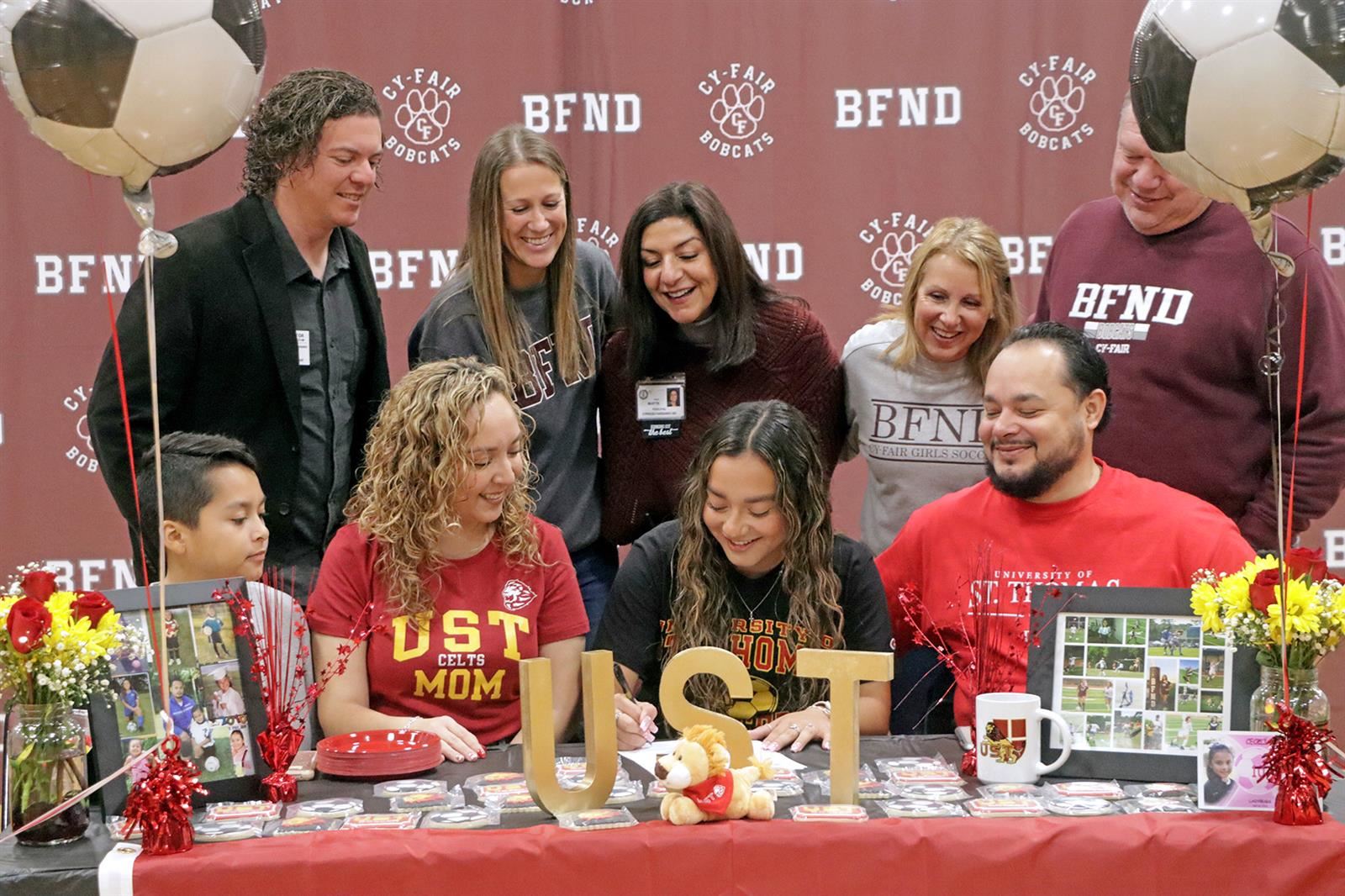 Cy-Fair High School senior Cecilia Escobar, seated second from right, signed a letter of intent to play soccer.